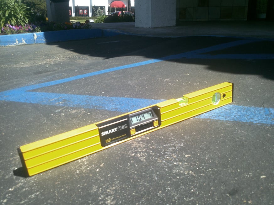 Grade violation on access aisles .jpg