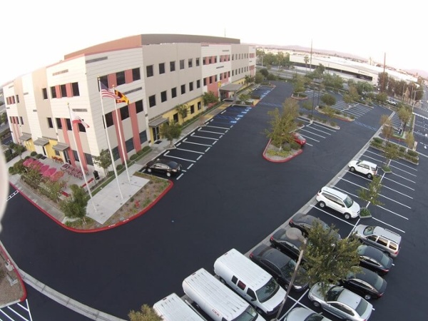 Maintain asphalt parking lot with seal coating